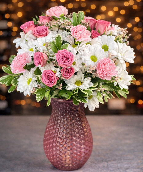 It’s Your Day, Mom! bouquet featuring pink roses, pink carnations, white daisies, and assorted greenery in a textured red vase from Griffin’s Floral Design in Columbus, OH