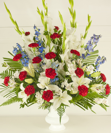 The red, white and blue arrangement reflects our nation's true colors. Suitable for funeral service.