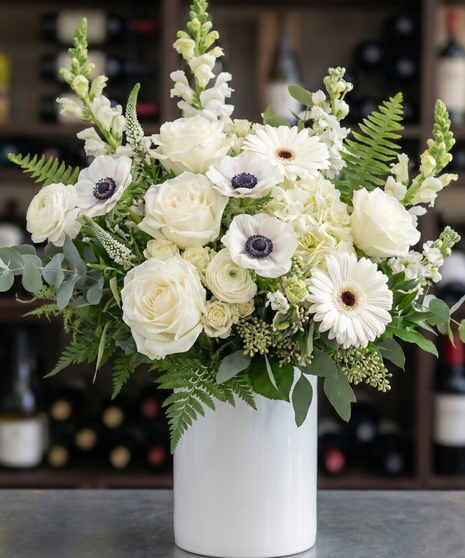 Elegant white splendor bouquet with roses, anemone, and gerbera daisies in Columbus, Ohio florist Griffins Floral