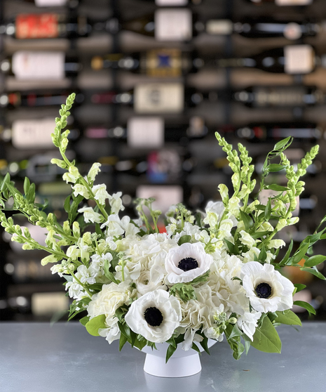 White Meadows Bouquet featuring white snapdragons, aromatic stock, hydrangea, and anemone delivered in Columbus, Ohio.